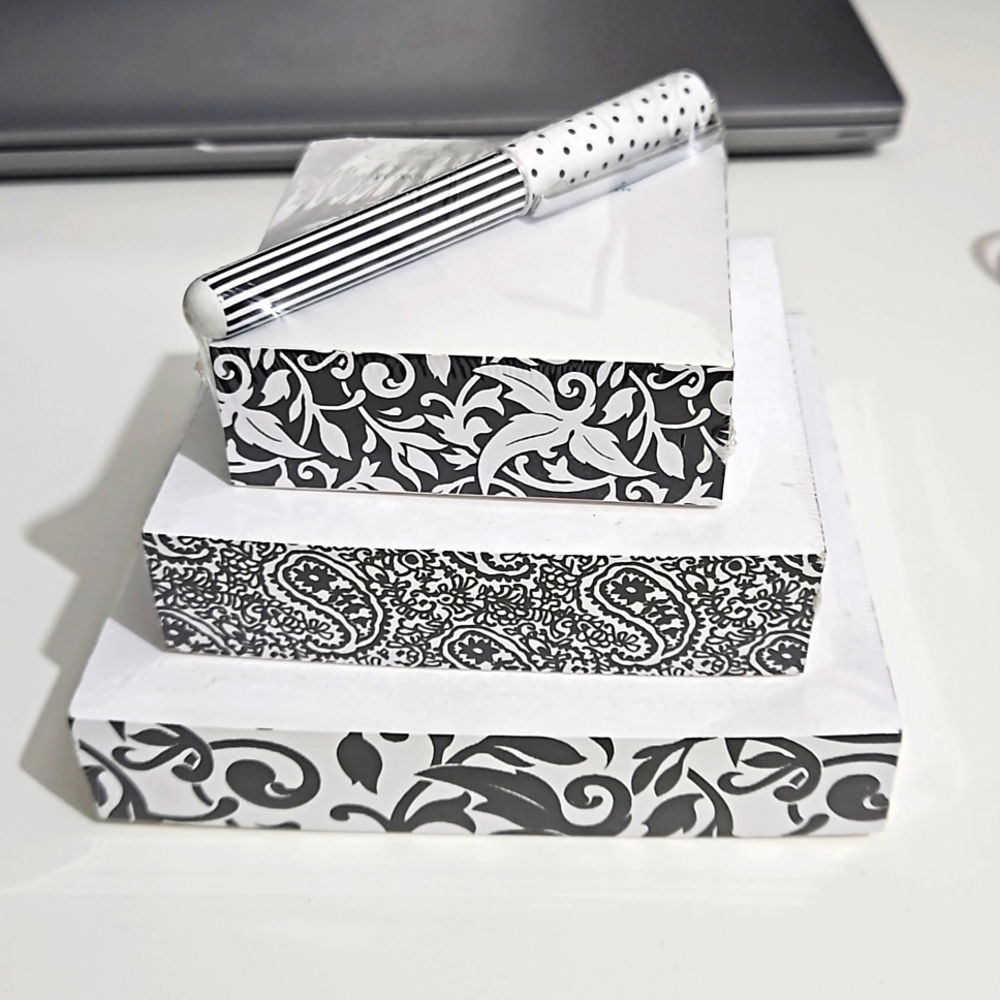 Lady Layne Ltd tower of notes and pen